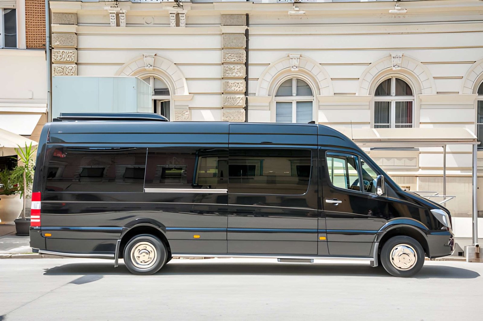 Interior of a chauffeur-driven Mercedes Sprinter showing individual executive seating
