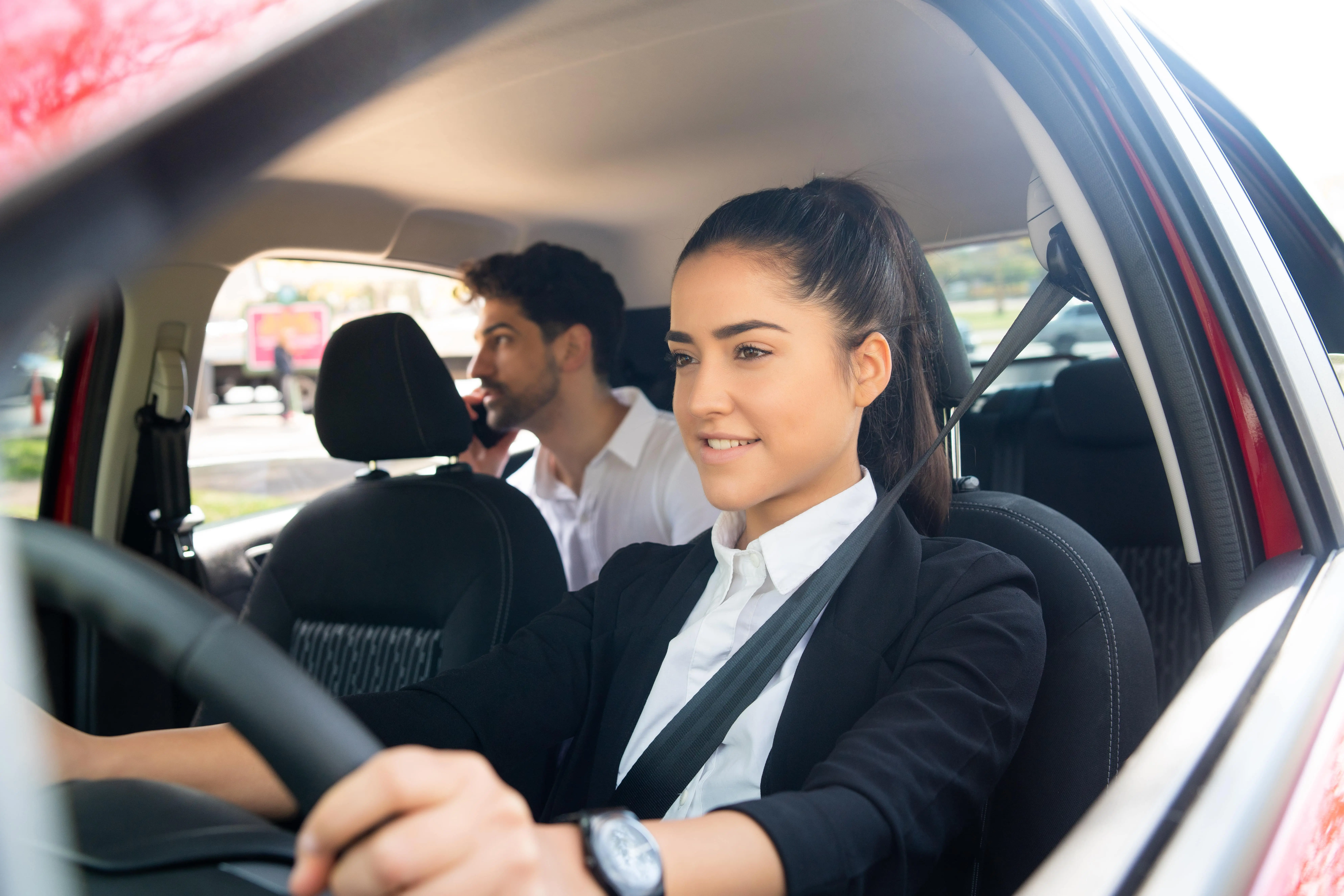 Luxury executive chauffeur vehicle cruising smoothly down a major UK highway linking London to northern cities